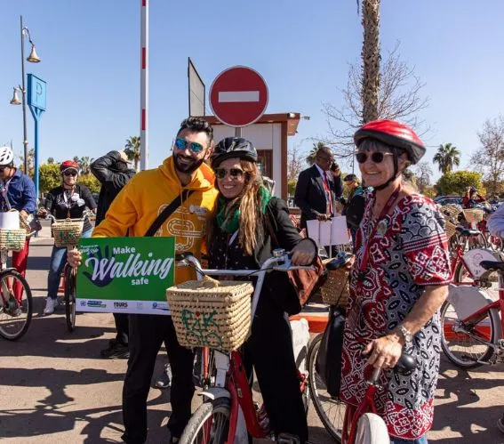 Community cycling event managed with traffic control measures to ensure pedestrian safety and organized road access