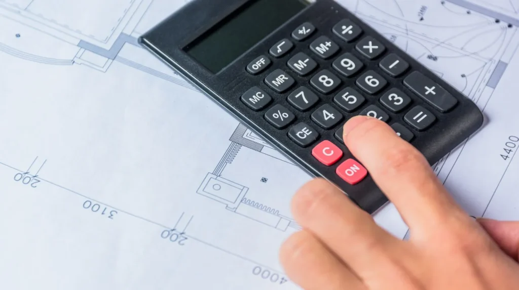 Engineer planning traffic control design timeline with laptop and safety helmet