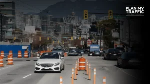 Urban road traffic with cones under Street Use Permit traffic control setup