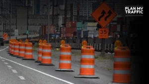 Road work zone with cones and signage showing Temporary Traffic Control Plan setup in BC