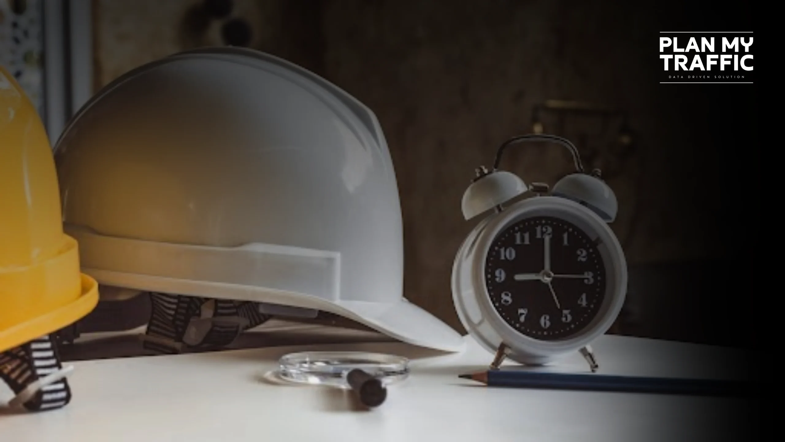 Safety helmets and clock showing outsourced Traffic Management Plan Burnaby for faster project delivery