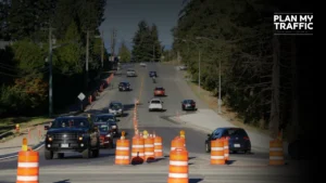 Road work zone with traffic cones and vehicles under Traffic Management Plan Vancouver