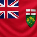 Flag of Ontario: red background (Red Ensign) with the Union Jack in the upper left canton and Ontario's shield of arms on the right, showing the Cross of St. George above a green field with three golden maple leaves.
