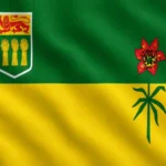 Flag of Saskatchewan: horizontally divided into green on top and golden yellow on the bottom; upper left displays the provincial shield with a lion and wheat sheaves; right side features a red and green western red lily, the provincial flower.